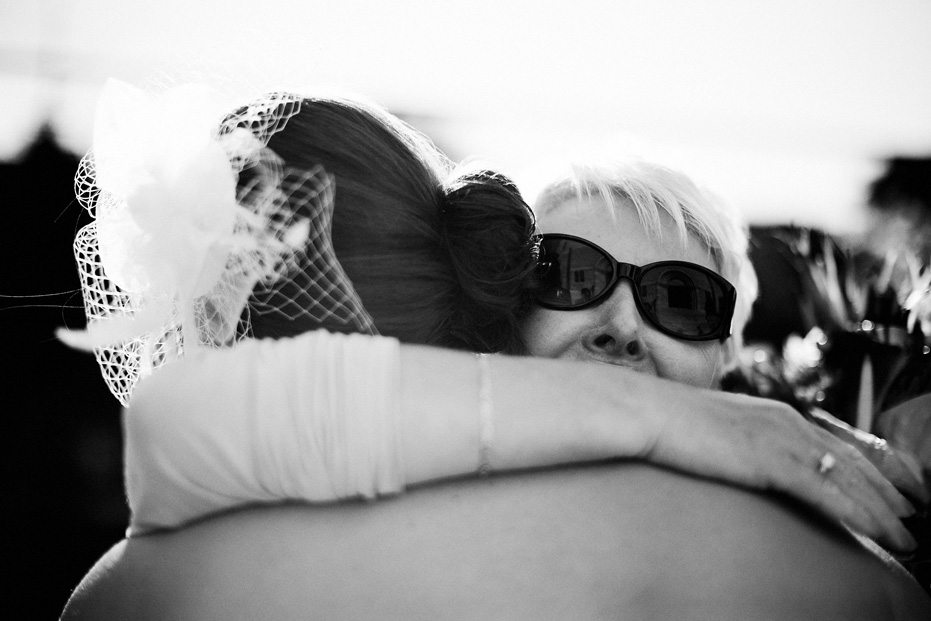 a big hug at a wedding by Kitchener wedding photographer