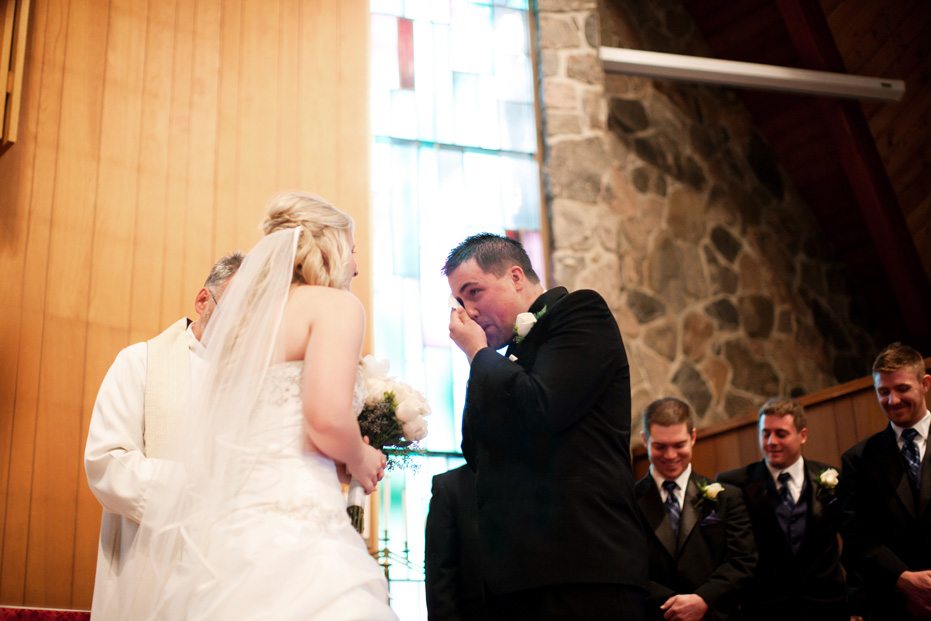 a funny moment at a Kitchener wedding ceremony as captured by Kitchener wedding photographer