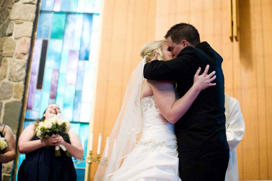 The bride and groom's first kiss at a wedding in Kitchener, Ontario