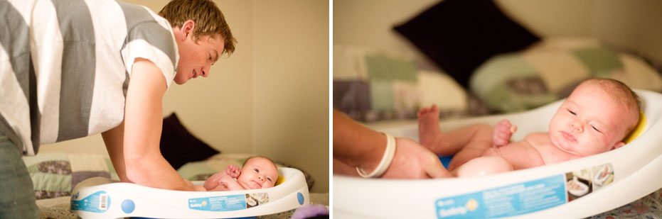 a new father bathes his little baby by documentary lifestyle photographer from Kitchener-Waterloo