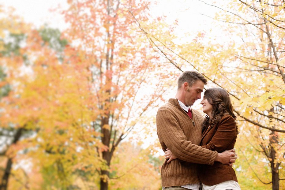fall leaves in High Park as backdrop for a modern engagement session by Toronto wedding photojournalist