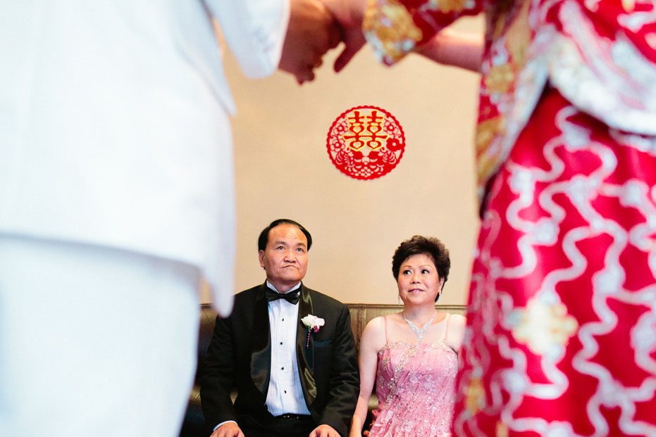 parents of the bride in Toronto during the tea ceremony as captured by Toronto wedding photojournalist