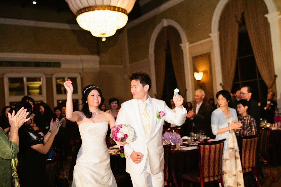 the bride and groom enters the Renaissance Room at Liberty Grand