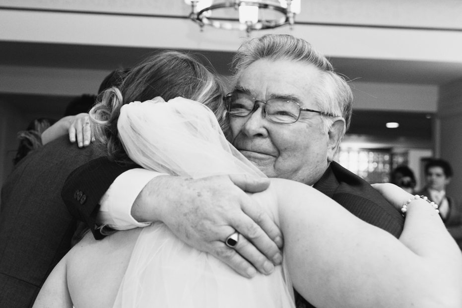 a hug from grandpa captured by wedding photojournalist from Kitchener-Waterloo