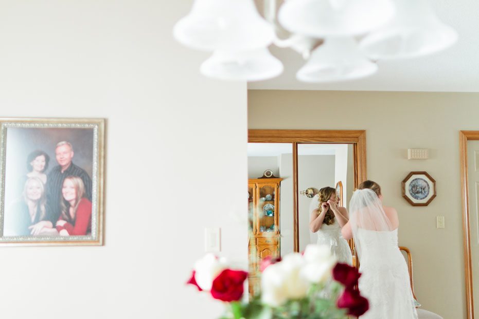 A bride in her parents home gets ready for her wedding day in Tillsonburg, Ontario