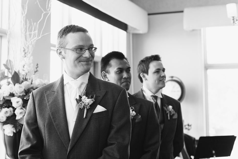 the groom sees his bride for the first time on their wedding day