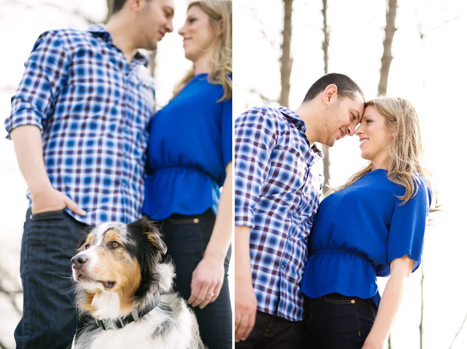 an engaged couple poses with their pet dog