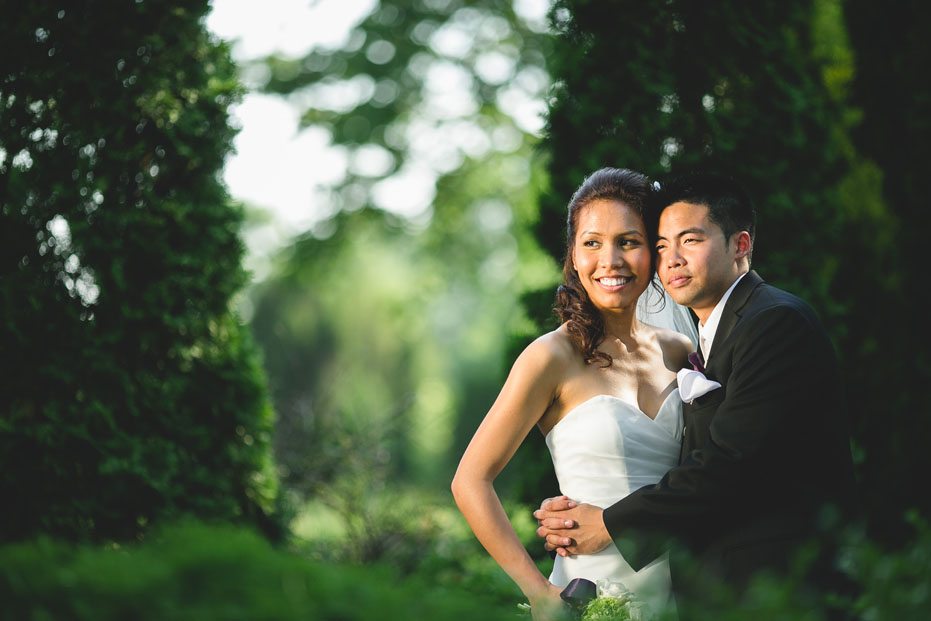 a modern portrait of the bride and groom at the grounds of Liuna Garden