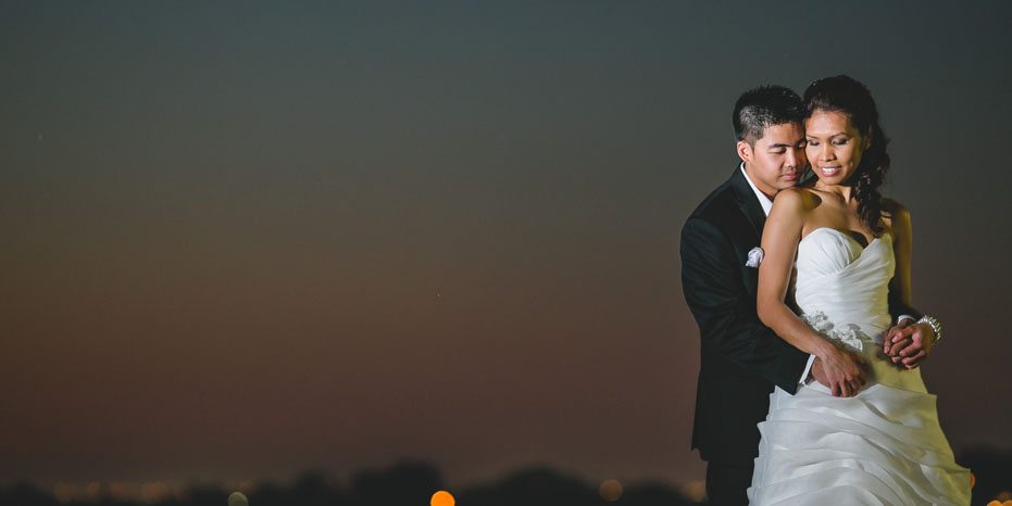 the bride and groom at sunset in Lake Ontario captured by wedding photographer in Toronto