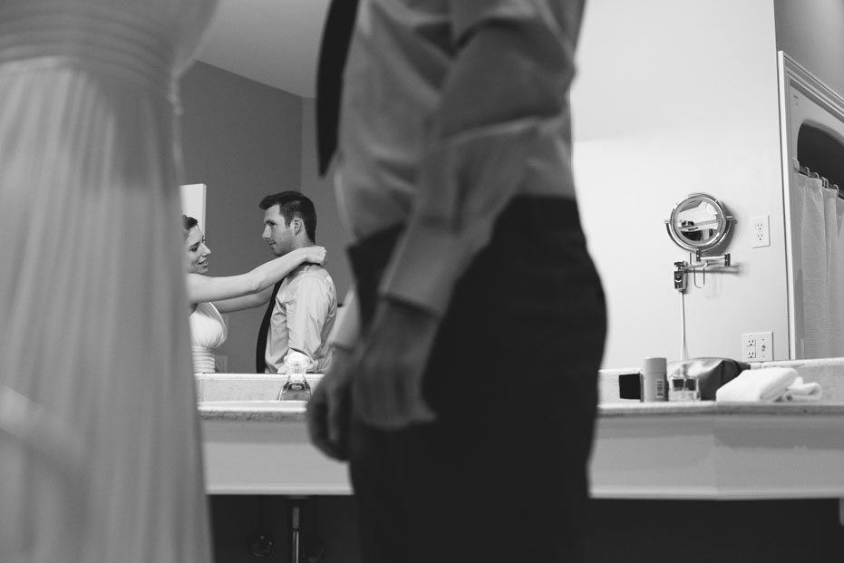 a bride and groom gets ready for their intimate wedding ceremony at the Flat Rocks Cellars in Jordan, Ontario